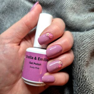 Picture of a model's hand wearing Stella & Emilie Dusty PInk Gel Polish